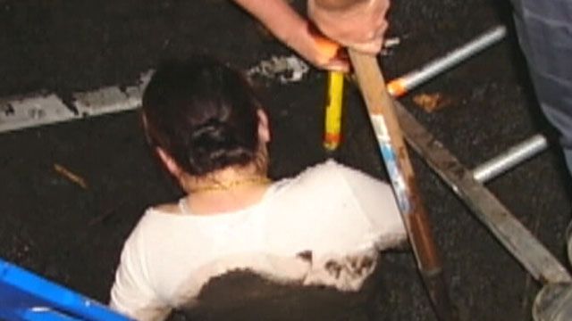 Firefighters rescue woman stuck in mud