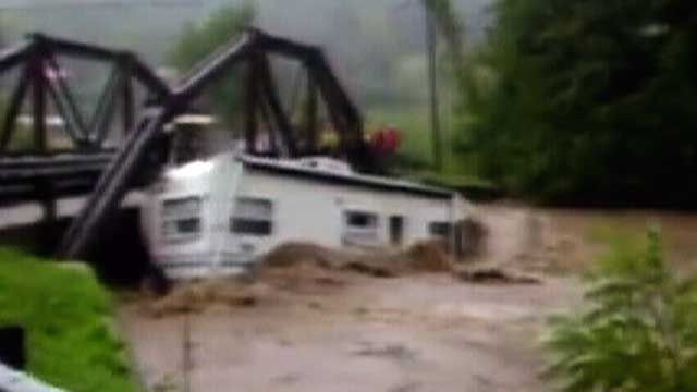 Video:  Floodwaters Slam RV into Bridge