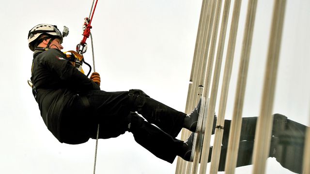 Royal rappels down 1,016 foot tower