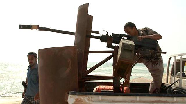 Libya Rebels Surround Qaddafi Stronghold