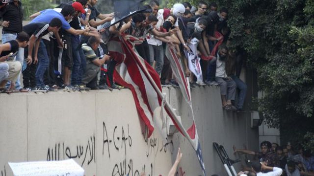Egyptian protesters scale US Embassy wall