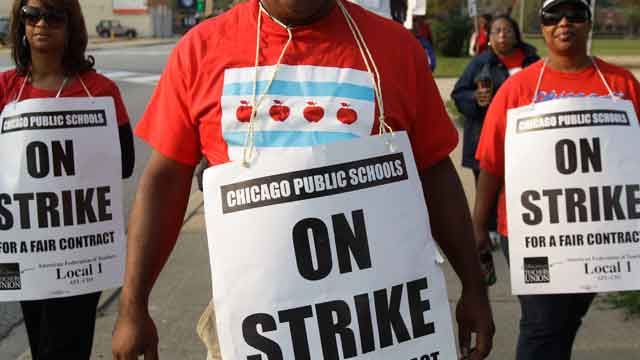 Chicago teachers consider offer, mayor seeks injunction