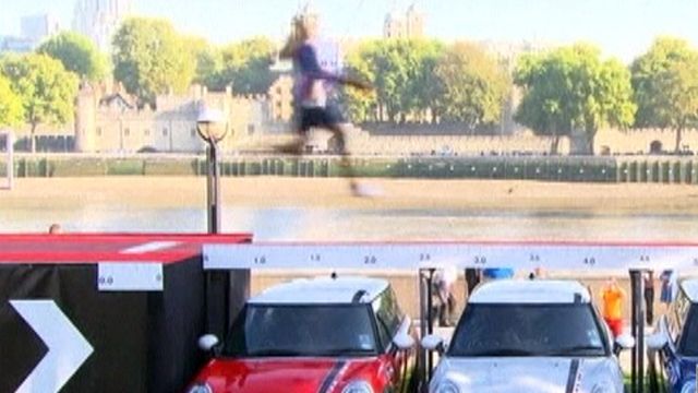 Around the World: Long Jumper Leaps Over 3 Mini Coopers