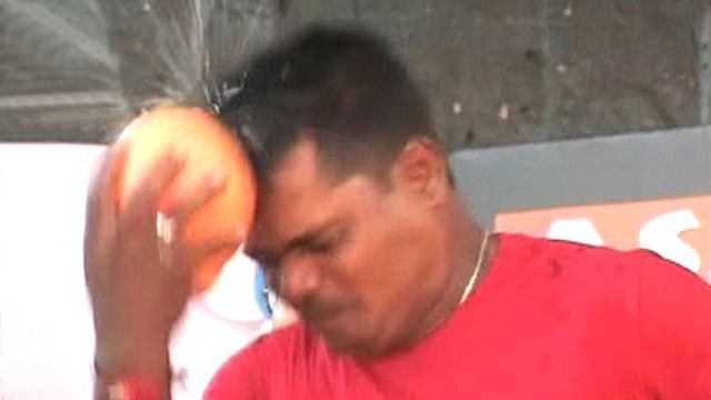 One tough nut: Record set for opening coconuts with head