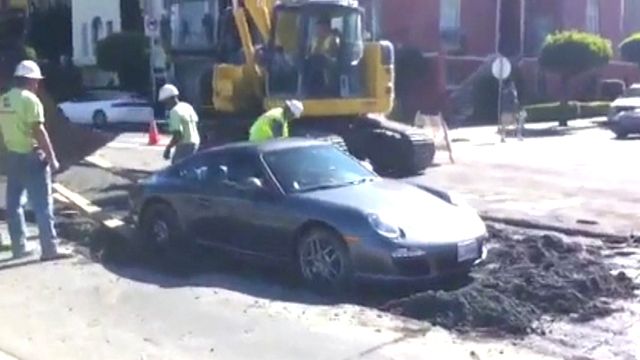 Porsche gets stuck in wet cement