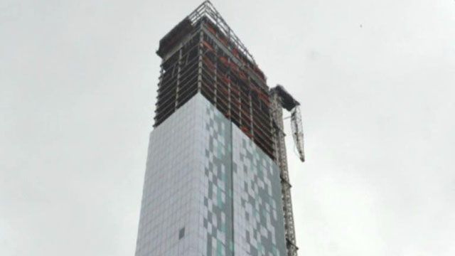 Construction crane collapses, dangles over midtown Manhattan