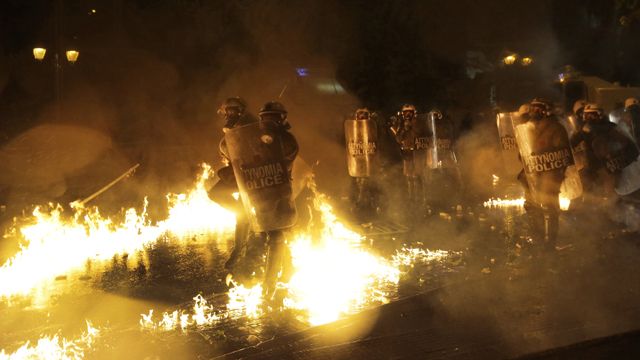 Rioters, police clash as Greece OKs new austerity measures