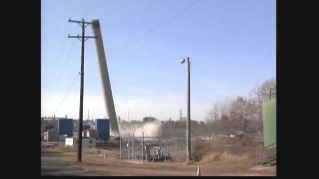 Tower Topples Wrong Way During Demolition