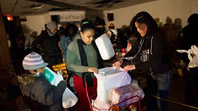 Hurricane Sandy victims line up for basic necessities
