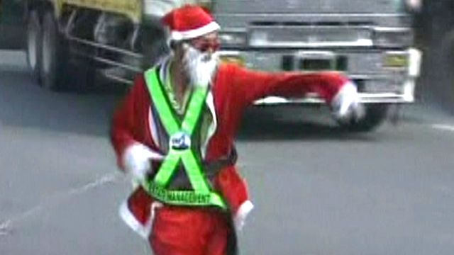 Dancing Santa Keeps Traffic Moving