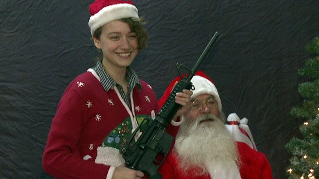 Gun-Toting Santa Claus Takes Christmas Portrait